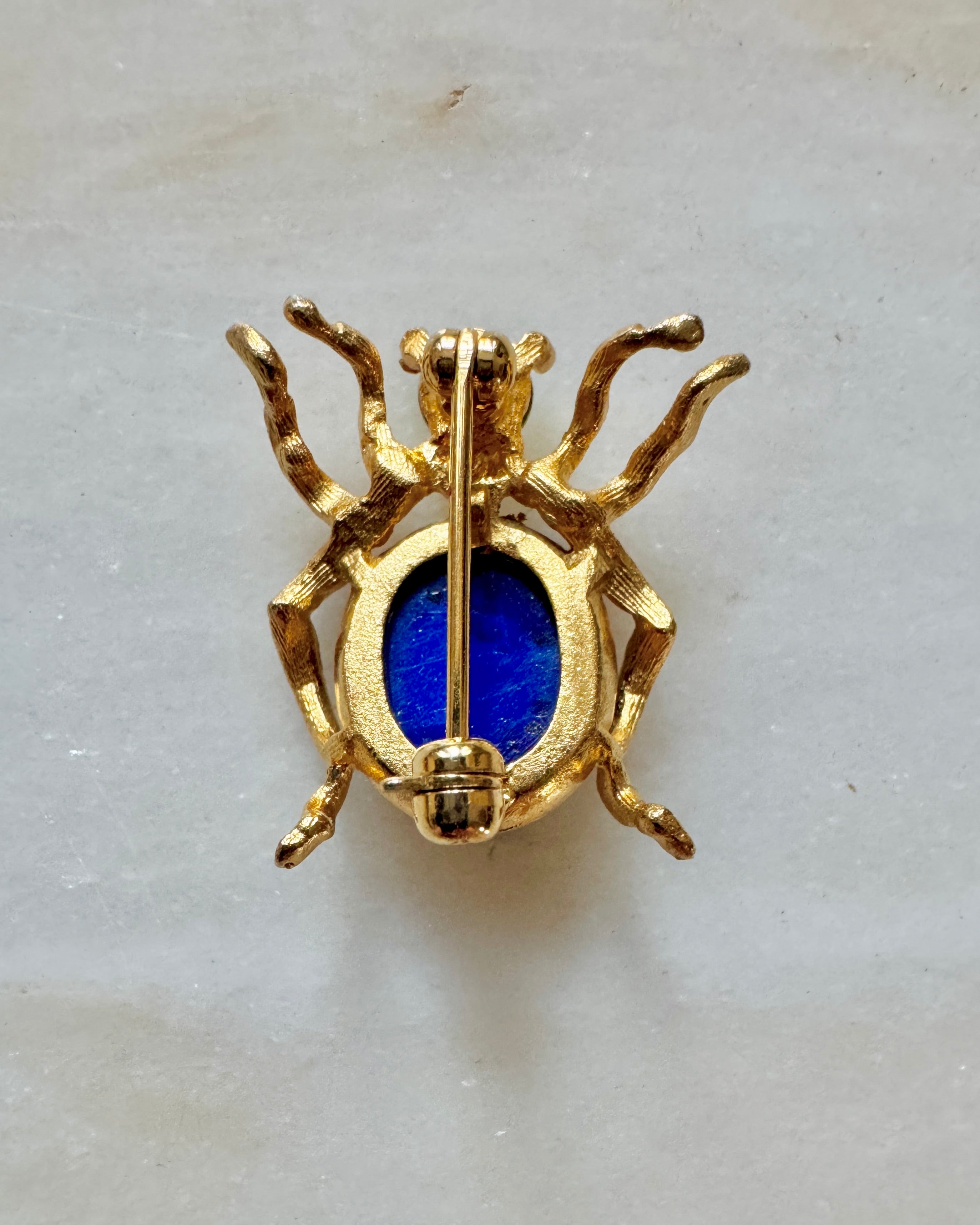 Vintage Costume Jewelry Spider Pin with Blue Stone and Gold Tone Frame